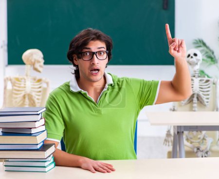 Photo for The funny male student in the classroom with skeleton - Royalty Free Image