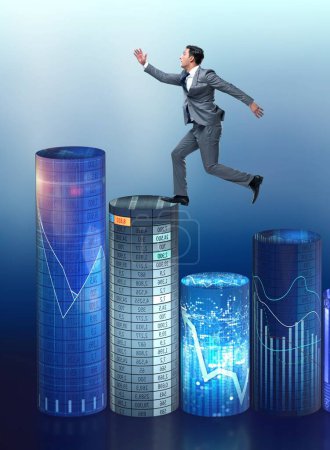 Photo for The businessman jumping over bar charts - Royalty Free Image