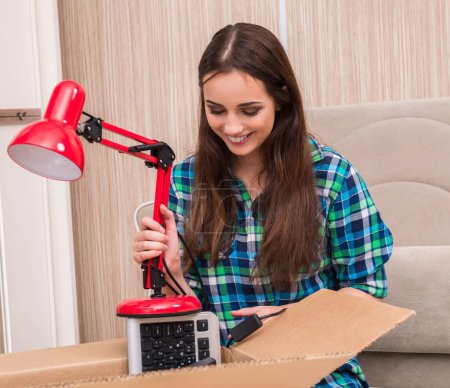 Photo for The young woman packing personal belongings - Royalty Free Image