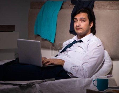 Photo for The young employee working at home after night shift - Royalty Free Image
