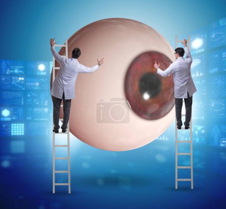 Photo for The doctor examining giant eye in medical concept - Royalty Free Image
