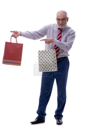 Photo for Old male boss holding bags isolated on white - Royalty Free Image