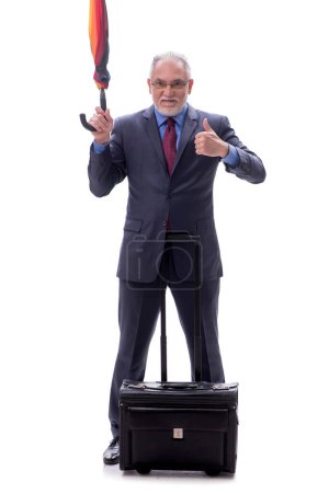 Photo for Businessman with an umbrella and luggage isolated on white - Royalty Free Image