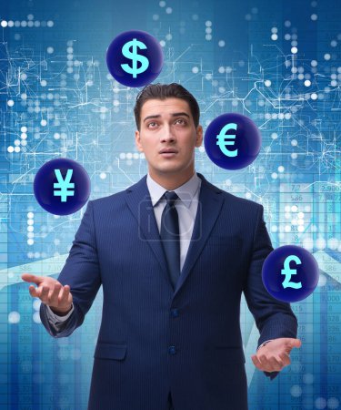 Photo for The businessman juggling between various currencies - Royalty Free Image