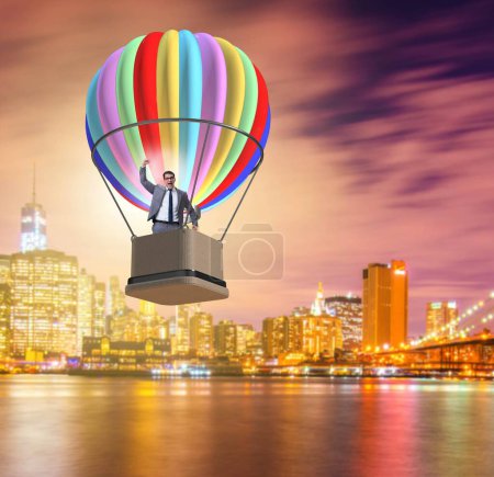 Photo for The businessman flying on balloon in challenge concept - Royalty Free Image