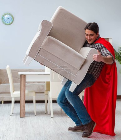 Photo for The super hero moving furniture at home - Royalty Free Image