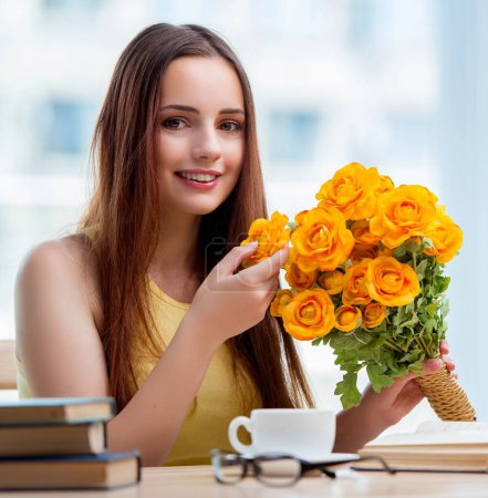 Photo for The young girl with present of flowers - Royalty Free Image