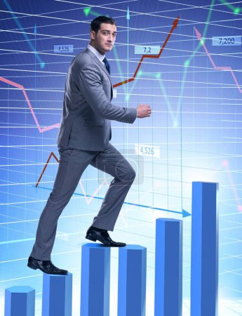 Photo for The businessman climbing bar charts in business concept - Royalty Free Image