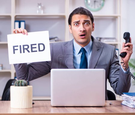 Photo for The young male employee being fired from his work - Royalty Free Image