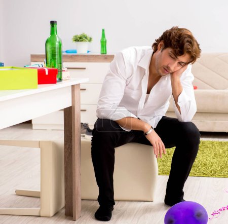 Photo for The young man having hangover after party - Royalty Free Image