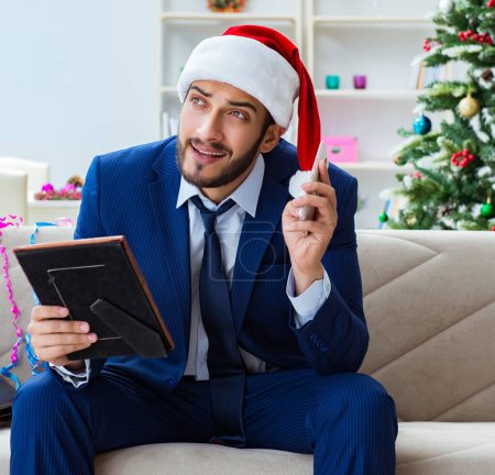 Photo for The businessman working at home during christmas - Royalty Free Image