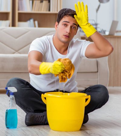 Photo for The man husband cleaning the house helping wife - Royalty Free Image