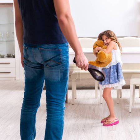 Photo for The angry father punishing his daughter - Royalty Free Image