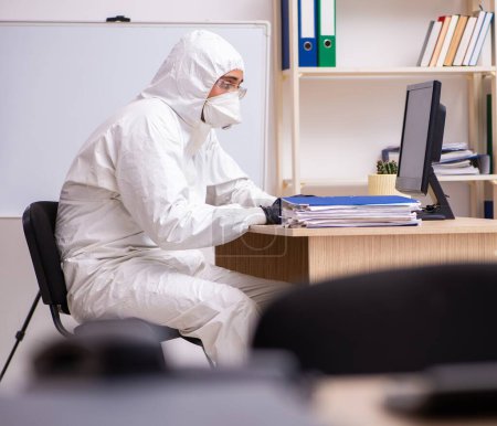 Photo for Office worker working in the quarantine self-isolation - Royalty Free Image