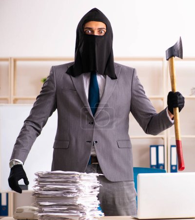 Photo for The male gangster stealing information from the office - Royalty Free Image