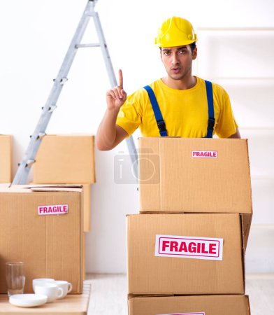 Photo for Young professional mover doing home relocation - Royalty Free Image