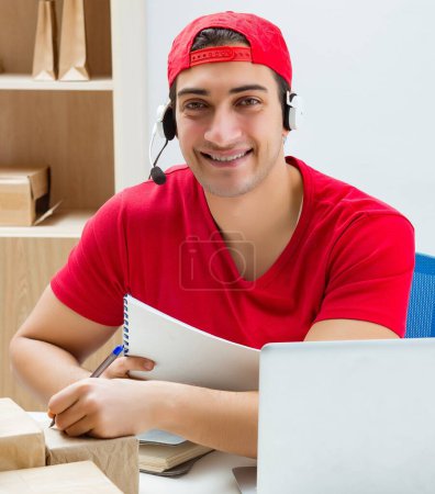 Photo for The call center worker at parcel distribution center in post office - Royalty Free Image