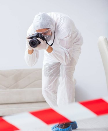 Photo for The forensic expert at crime scene doing investigation - Royalty Free Image