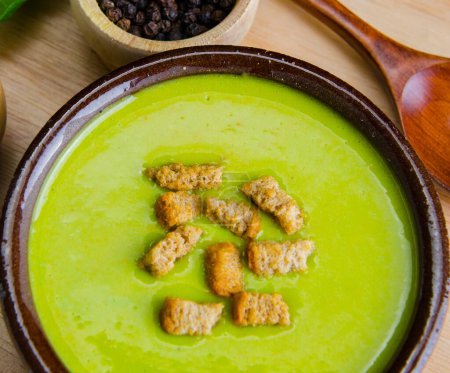 Photo for The spinach soup served on wooden board - Royalty Free Image