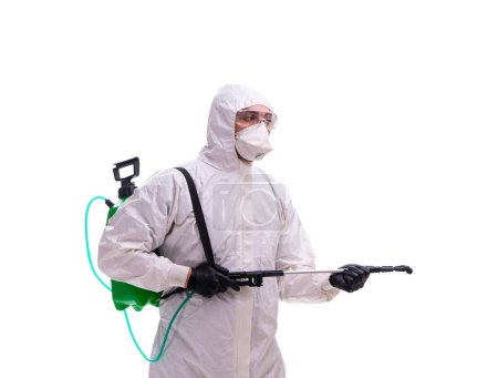 Photo for Young male contractor disinfecting in the coronavirus concept - Royalty Free Image