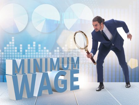 Foto de El concepto de salario mínimo con empresario - Imagen libre de derechos