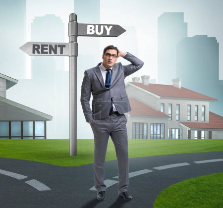 Photo for The businessman at crossroads betweem buying and renting - Royalty Free Image