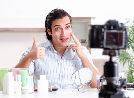 Photo for The young handsome man recording his blog in hygiene concept - Royalty Free Image