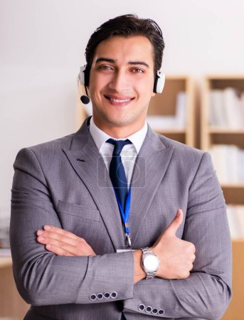 Photo for The handsome customer service clerk with headset - Royalty Free Image
