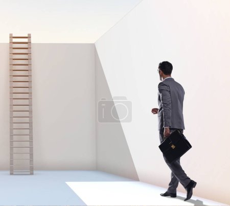 Photo for The businessman climbing a ladder to escape from problems - Royalty Free Image