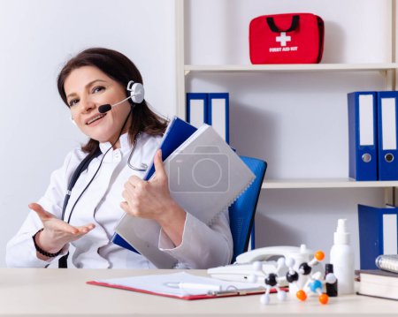 Photo for The middle-aged female doctor in telemedicine concept - Royalty Free Image