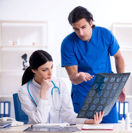Photo for The two young doctors working in the clinic - Royalty Free Image