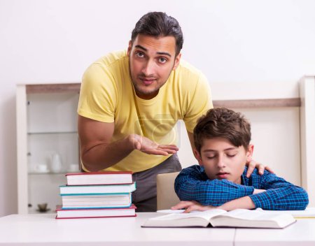 Photo for The father helping his son to prepare for school - Royalty Free Image