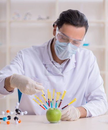 Photo for The male nutrition expert testing food products in lab - Royalty Free Image