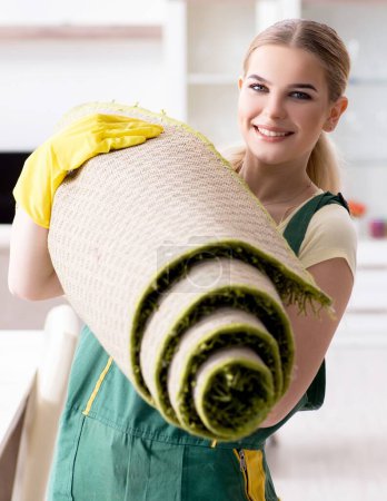 Photo for The professional female cleaner cleaning carpet - Royalty Free Image