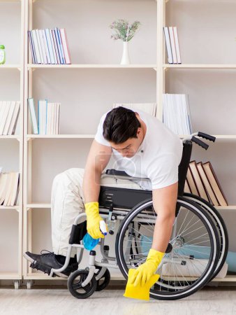 Photo for The disabled cleaner doing chores at home - Royalty Free Image