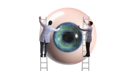 Photo for The doctor examining giant eye in medical concept - Royalty Free Image