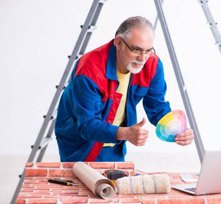 Photo for The old contractor doing renovation at home - Royalty Free Image