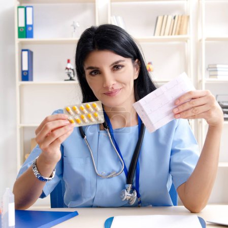 Photo for The female doctor cardiologist working in the clinic - Royalty Free Image