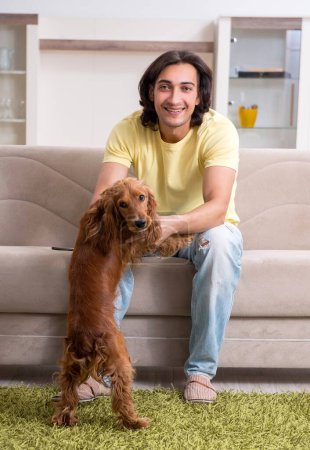 Photo for Young man with cocker spaniel - Royalty Free Image