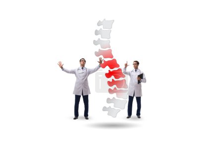 Foto de Concepto médico con los médicos y la columna vertebral - Imagen libre de derechos