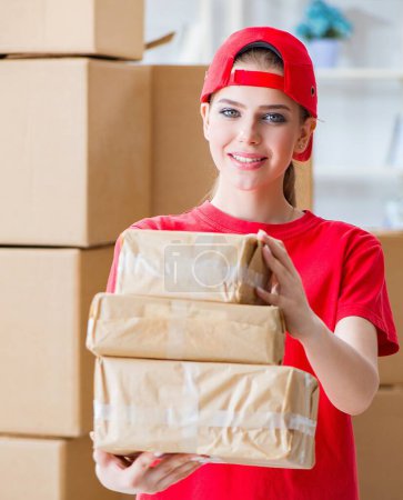 Photo for Young woman working in parcel distribution center - Royalty Free Image