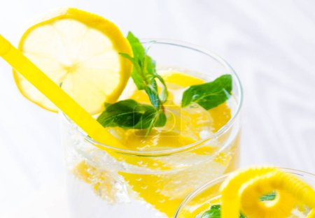 Photo for The glasss of mojito with lemon and drinking straw - Royalty Free Image