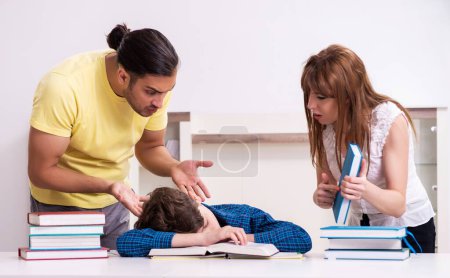 Photo for The parents helping their son to prepare for school - Royalty Free Image