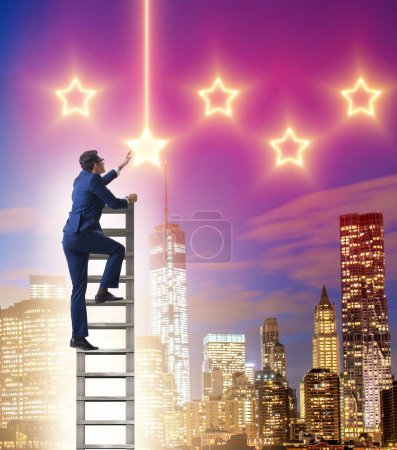 Photo for The businessman reaching out for stars - Royalty Free Image