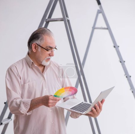 Photo for Old husband contractor in renovation concept - Royalty Free Image