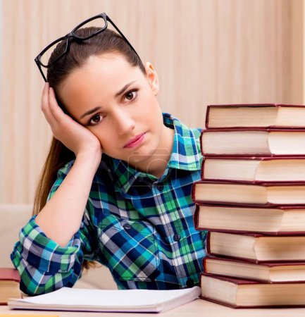 Photo for The young female student preparing for exams - Royalty Free Image