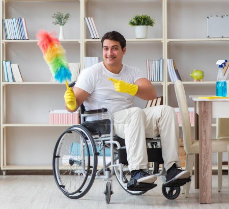 Photo for The disabled cleaner doing chores at home - Royalty Free Image