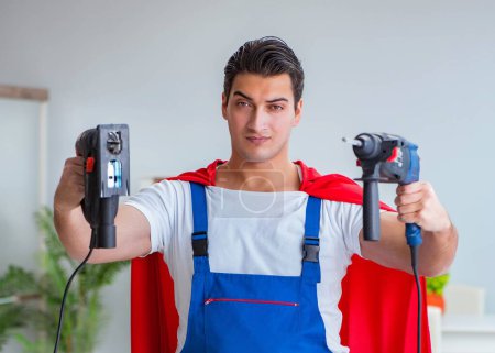 Photo for The super hero repairman working at home - Royalty Free Image