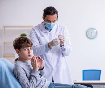 Photo for The young boy visiting doctor in hospital - Royalty Free Image