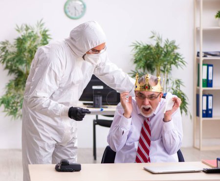 Photo for Old employee catching coronavirus at the workplace - Royalty Free Image